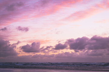 Fototapeta na wymiar Pink clouds at sunset over the Washington Coast