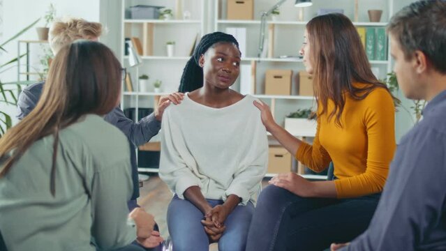 African American Woman Shares Her Personal Addiction Problem, Emotional Pain, Receives Psychological Support, Compassion, Empathy From People in a Group Therapy Session. Abuse, Violence, Depression.