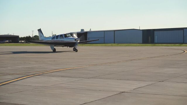 Small Aircraft Taxiing onto Runway