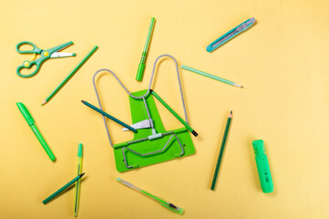 A variety of green stationery. School stationery in one color. Same color school items.