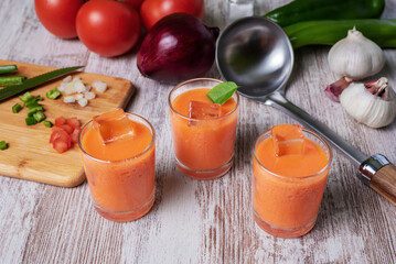 Gazpacho, cold soup typical of Andalusia based on tomato, garlic, pepper and onion. Presented in small glasses to drink.