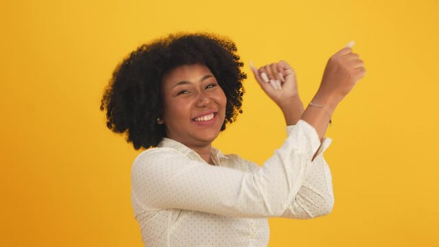 Happy smiling African American woman with afro hairstyle happy positive smile chat email laptop isolated over  color background.