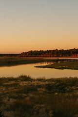 Naklejka premium sunset over the river