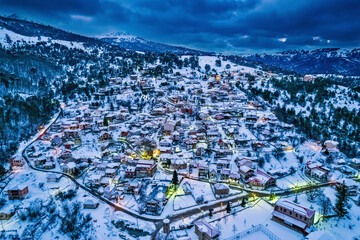 When night falls over snowy Smixi village, Vasilitsa mountain, Grevena, West Macedonia, Greece. - obrazy, fototapety, plakaty