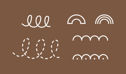 A set of abstract geometric shapes in the form of loops and rainbows.