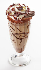 Milkshake garnished with whipped cream and chocolate