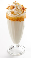 Milkshake garnished with whipped cream and popcorn