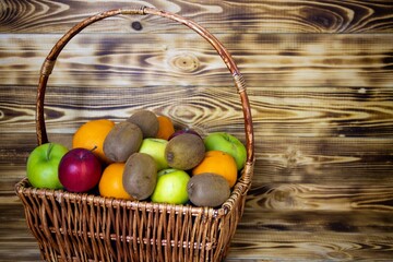 A wicker basket with bright fruits.