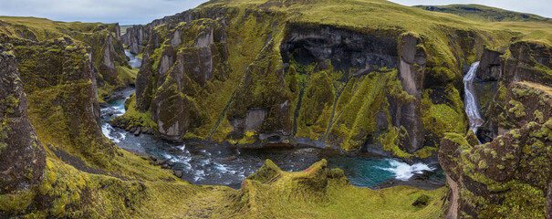 Fjaðrá river flowing through beautiful Fjadrargljufur canyon. Southern Iceland. Autumn overcast day.
