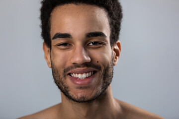 Portrait of a young african american man on a white background.