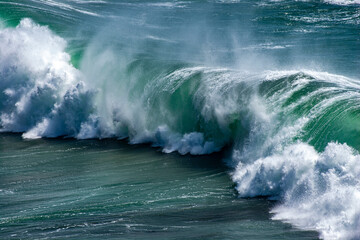 Waves breaking on the shore in a summer storm