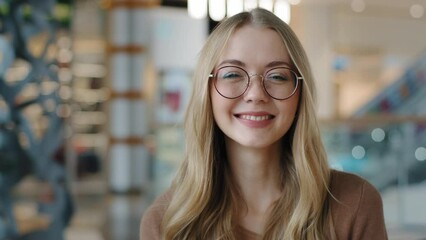 Head shot happy portrait caucasian girl in glasses young woman satisfied with ophthalmology services millennial blonde with healthy white toothy smile looking at camera confident model posing indoors - Powered by Adobe