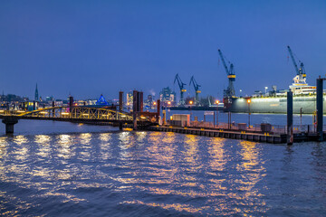 Fototapeta premium Hamburg, Germany. View of the harbor and the river Elbe at night.