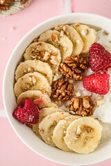 rice porridge with banana and raspberries