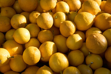 Full Frame of Fresh juicy lemons on the farmers market