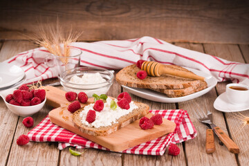 Rye bread with cottage cheese and raspberries.