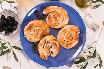 Pastry swirls with cheese and olive filling.
