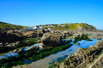 Fototapeta na wymiar Rocks and houses on the coast of Cap Gris Nez at a beautiful sunny day, Pas-de-Calais, Hauts-de-France, France