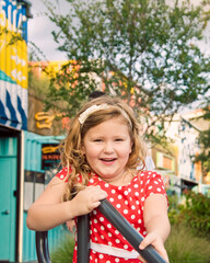 Happy Girl in Red polka dotted dress