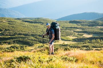 Sporty hiker with backpack in Tatra Mountains, Poland