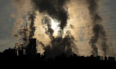 Electrical wiring and smoke in the chimneys polluting the air.