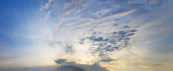 Naklejka na ściany i meble Panorama of sunset sky with clounds