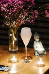 beautiful pink cocktail with colored sprinkling in the night bar