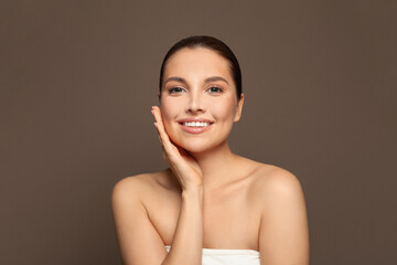 Happy woman with healthy clean skin portrait. Facial treatment, skincare, cosmetology, beauty and spa concept.