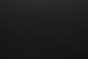 black artificial leather with waves and folds on PVC base