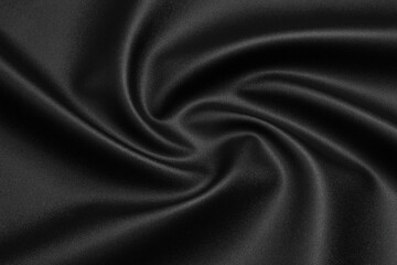 black artificial leather with waves and folds on PVC base