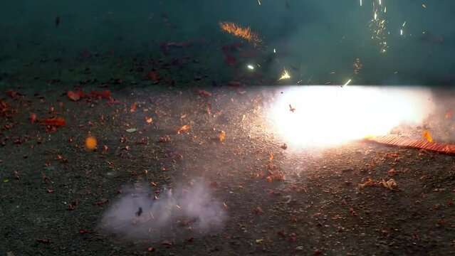 Celebration Lunar New Year with fire cracker burning at floor