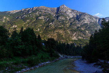 Fototapeta na wymiar morning hours near the Kamp Soča, the River Soča is flowing slowly, Slovenian Alps
