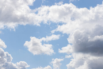 Naklejka na ściany i meble Blue sky background. Blue sky with clouds close up.