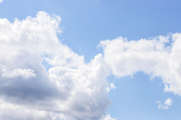 Blue sky background. Blue sky with clouds close up.