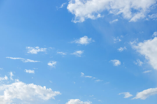 Beautiful blue clouds in the sky. Blue sky background.