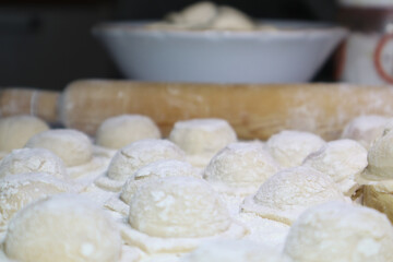 Fototapeta na wymiar Dumplings made by hand. Traditional Russian food