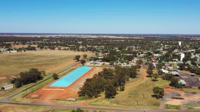 Panorama of Nyngan town shopping village and streets in aerial 4k hover.

