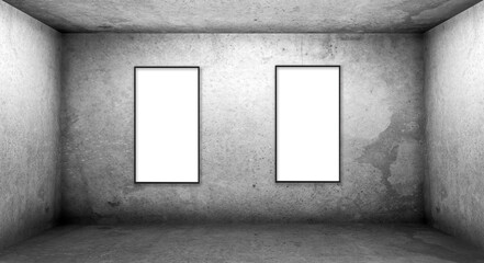 Two blank posters on concrete wall in dark room