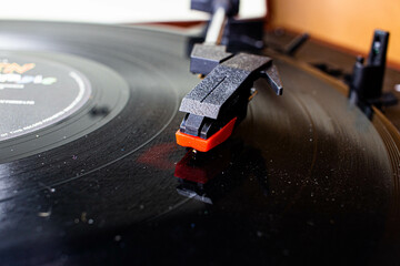 close-up on a gramophone needle in a modern turntable and a vinyl record