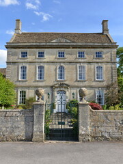 exterior view of a beautiful old house in an english village
