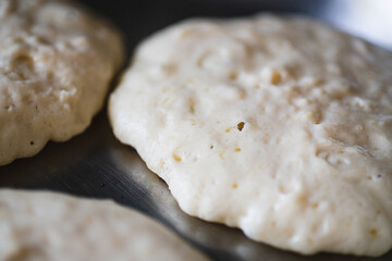 Pancake Batter in a Hot Pan. Homemade Pancakes Cooking in a Stainless Steel Pan. Cooking Breakfast Lifestyle.