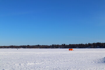 Skidoos and ice huts on Lake Simcoe Jacksons Poijnt