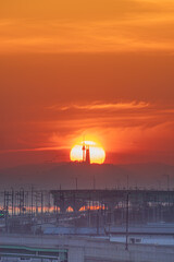 sunrise between buildings and towers
