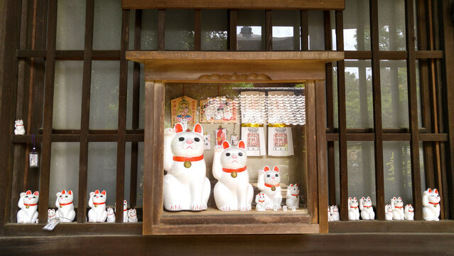 Lucky cats and omamori for sale at 
Gotokuji Temple in Setagaya, Tokyo, Japan
