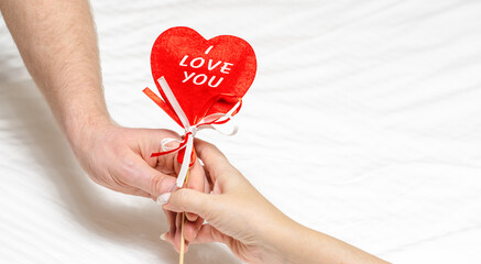 Red heart i love you in male and female hands. Valentine's day holiday