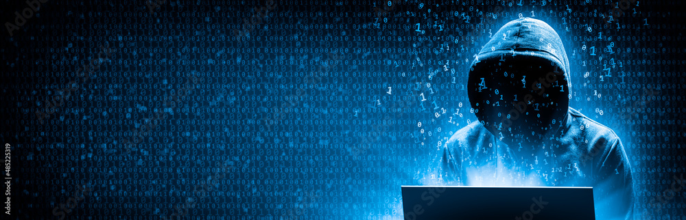 Wall mural silhouette of hooded criminal hacking computer on binary code background - cyber crime concept