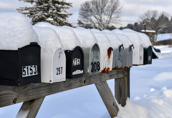 Mailboxes covered with fresh snow along rural road - 485228351
