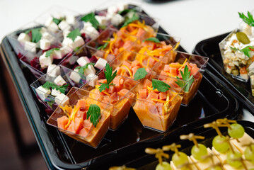 catering delivery tray servings of salads in plastic containers takeaway