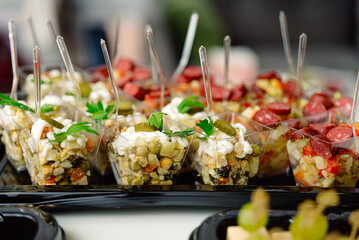 catering delivery tray servings of salads in plastic containers takeaway. Plastic food delivery tray.