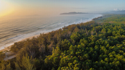 Fototapeta na wymiar Amazing beach with sunrise, Mozambique beach, Florianópolis, Santa Catarina, Brazil, droneview, topview
